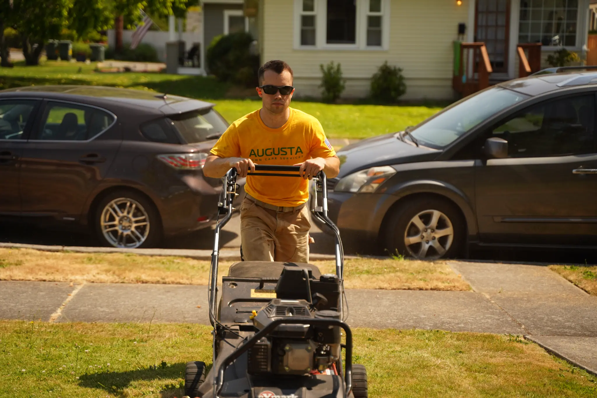 Mike Andes mowing a residential lawn